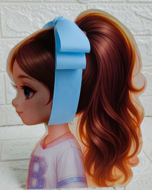 Illustration of a girl with brown hair in pigtails wearing a TinyShiny Bow Baby Blue color 