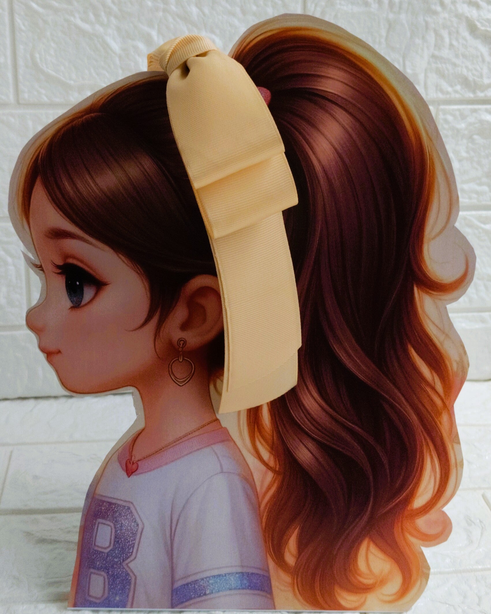 Illustration of a girl with brown hair in pigtails wearing a TinyShiny Bow Beige color 