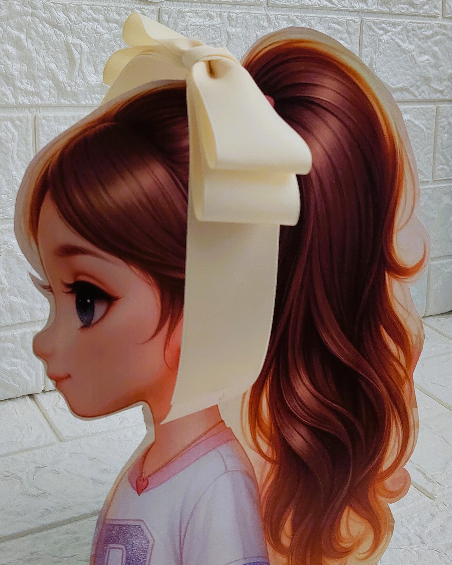 Illustration of a girl with brown hair in pigtails wearing a TinyShiny Bow Cream color 