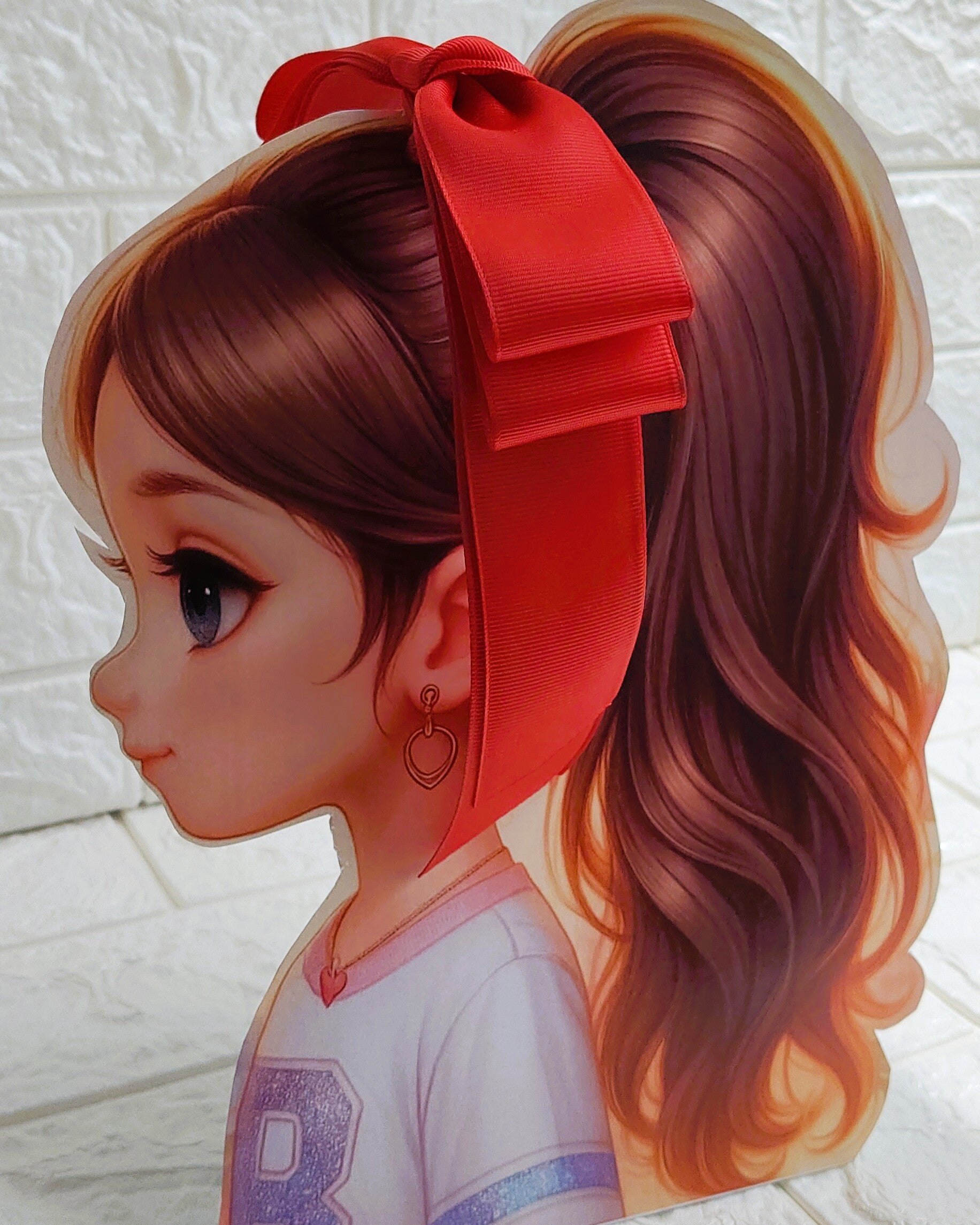 Illustration of a girl with brown hair in pigtails wearing a TinyShiny Bow Maroon color 