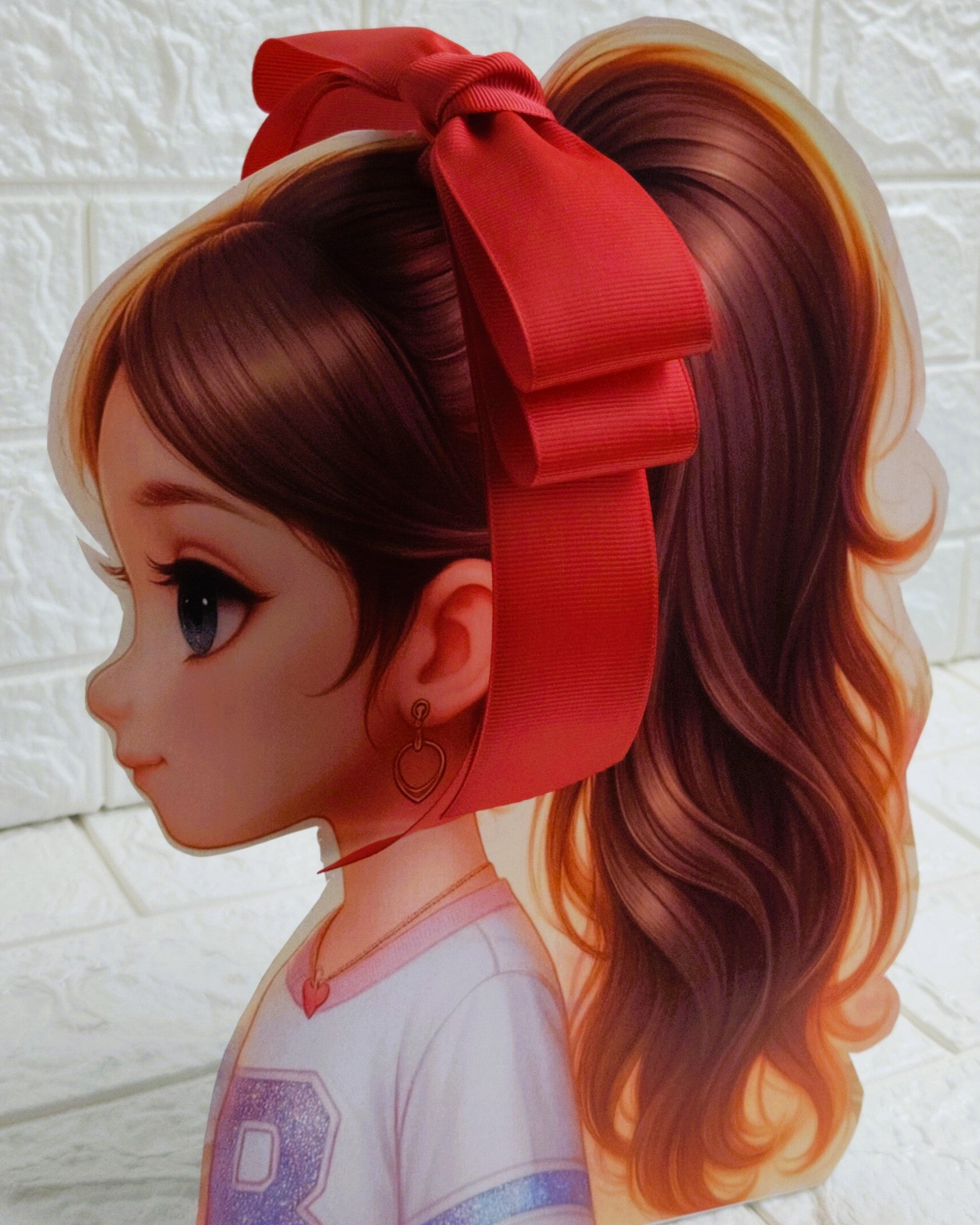 Illustration of a girl with brown hair in pigtails wearing a TinyShiny Bow Red color 