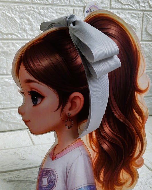 Illustration of a girl with brown hair in pigtails wearing a TinyShiny Bow Silver color 