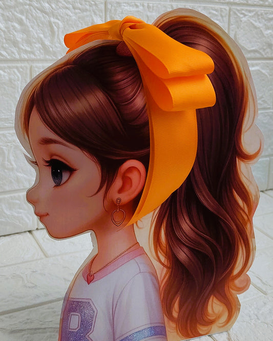Illustration of a girl with brown hair in pigtails wearing a TinyShiny Bow Tangerine color 