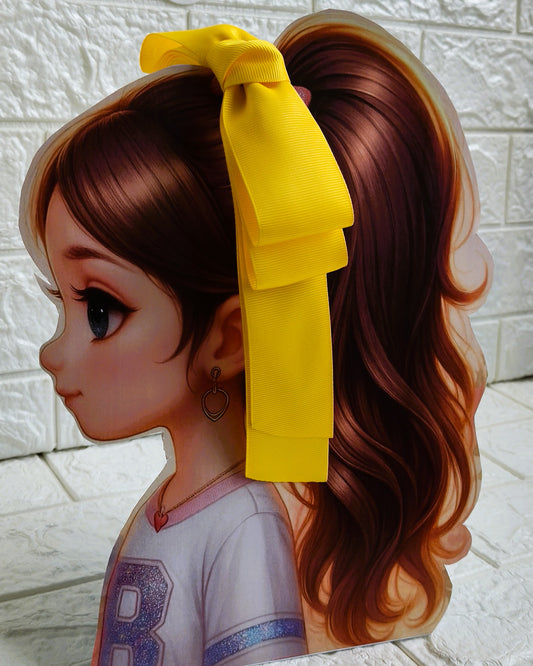 Illustration of a girl with brown hair in pigtails wearing a TinyShiny Bow Yellow color 
