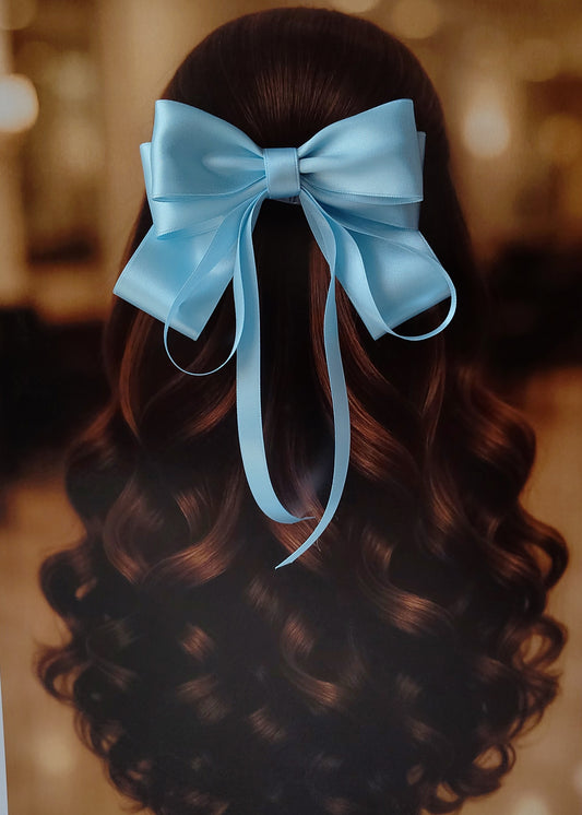 Back view of a girl with long curled hair wearing a large bright Baby Blue satin bow - perfect for festive or formal occasions - TinyShiny
