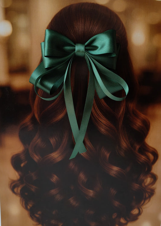 Back view of a girl with long curled hair wearing a large bright Dark Green satin bow - perfect for festive or formal occasions - TinyShiny