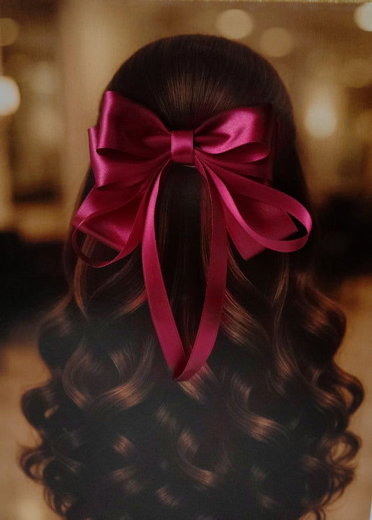 Back view of a girl with long curled hair wearing a large bright Maroon satin bow - perfect for festive or formal occasions - TinyShiny