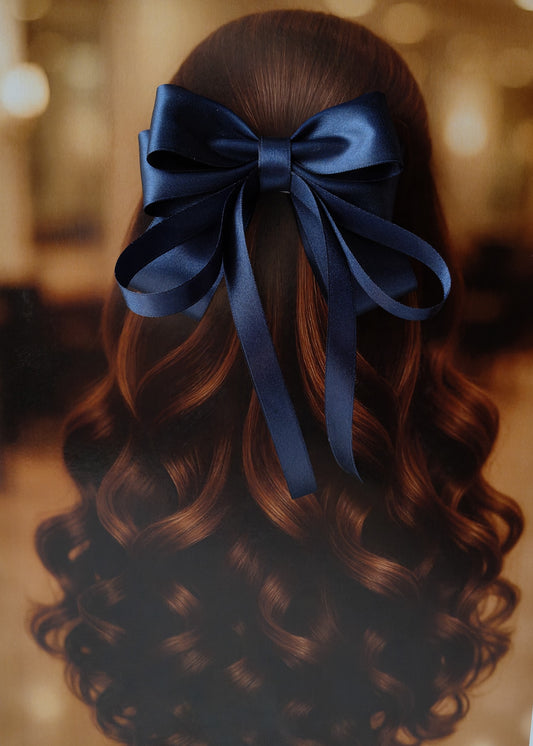 Back view of a girl with long curled hair wearing a large bright Navy Blue satin bow - perfect for festive or formal occasions - TinyShiny