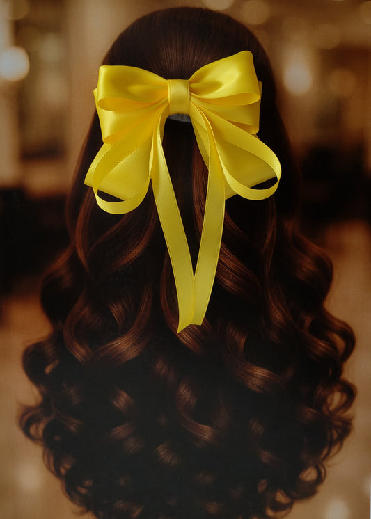 Back view of a girl with long curled hair wearing a large bright yellow satin bow - perfect for festive or formal occasions - TinyShiny